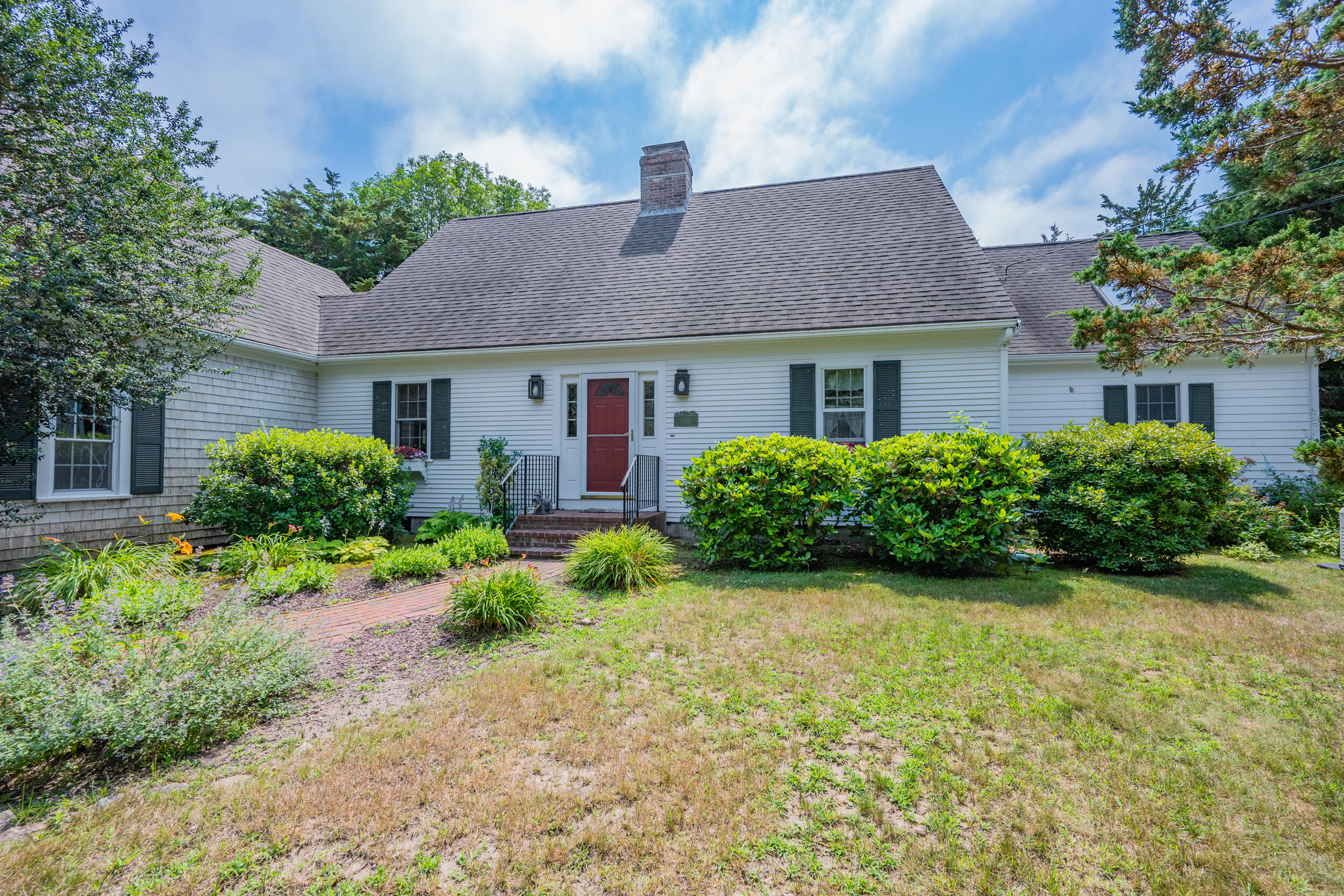 4323 Main Street Barnstable, MA 02630 - Photo 2 of 33 a front view of a house with garden