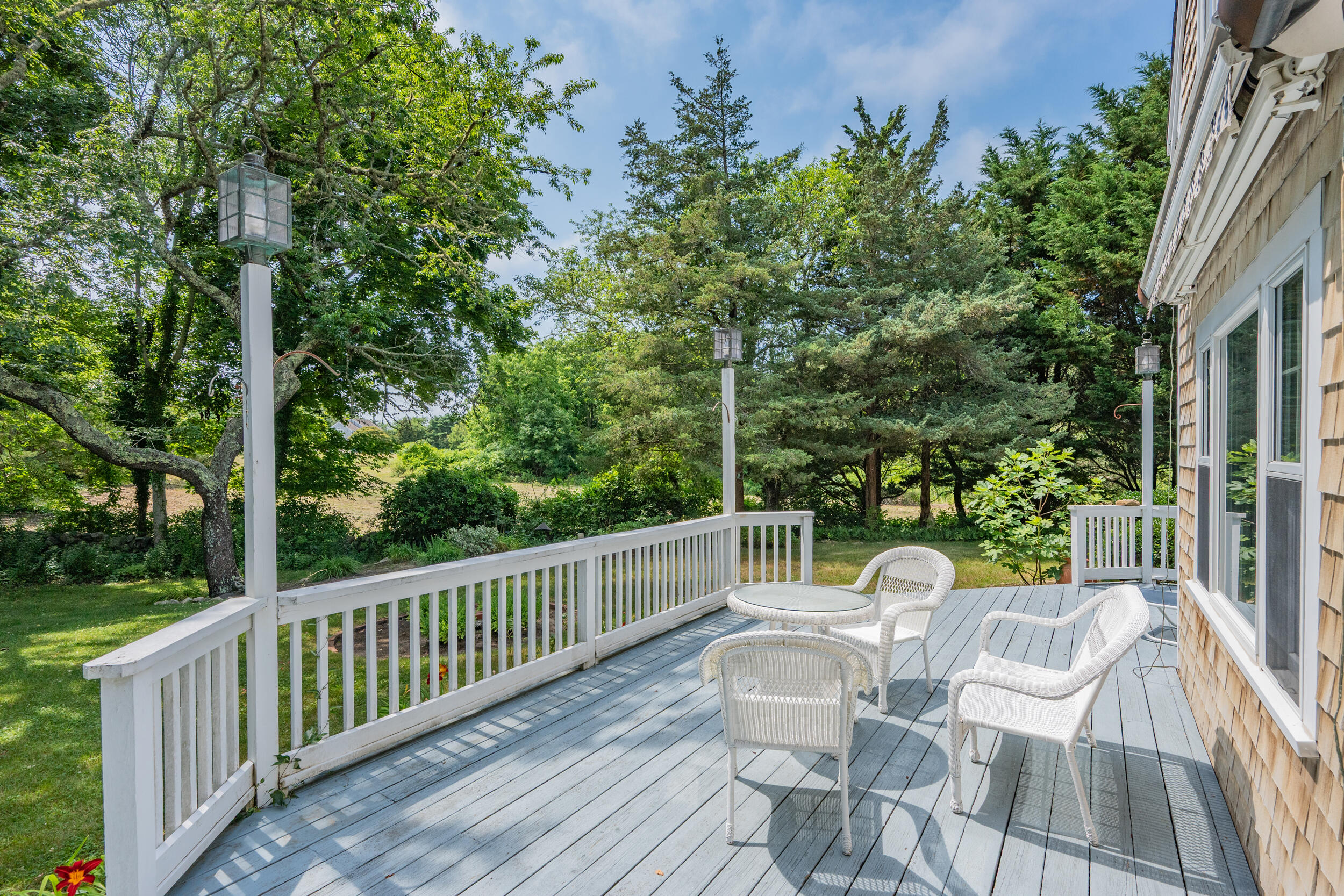 4323 Main Street Barnstable, MA 02630 - Photo 6 of 33 a view of a chair and table in the balcony