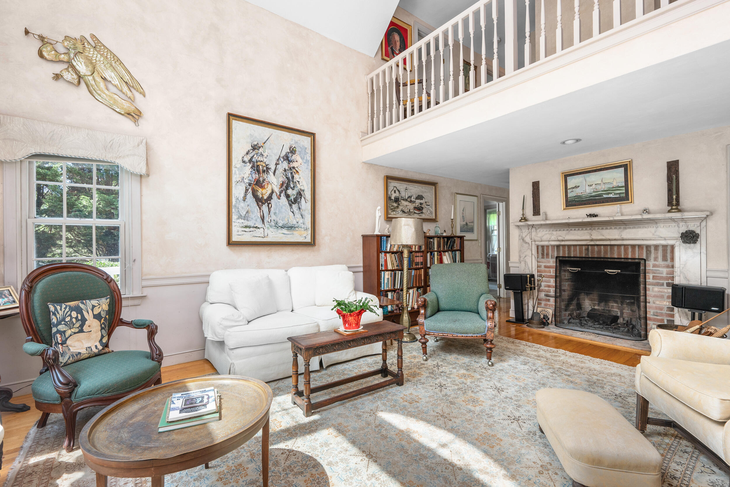 4323 Main Street Barnstable, MA 02630 - Photo 10 of 33 a living room with furniture a window and a fireplace