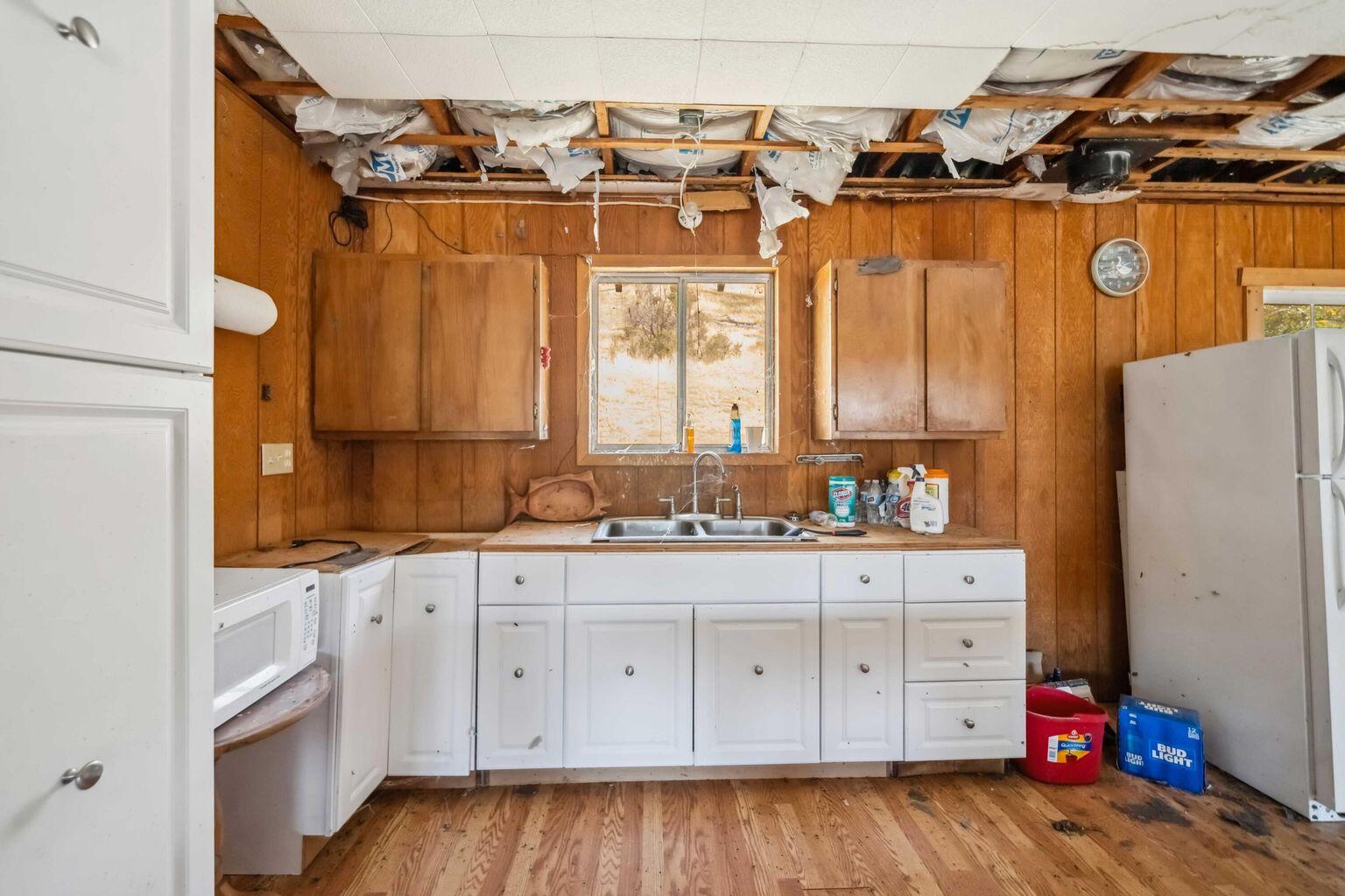 0 Vestal Road Platina, CA 96076 - Photo 11 of 34 a kitchen with a sink window and cabinets