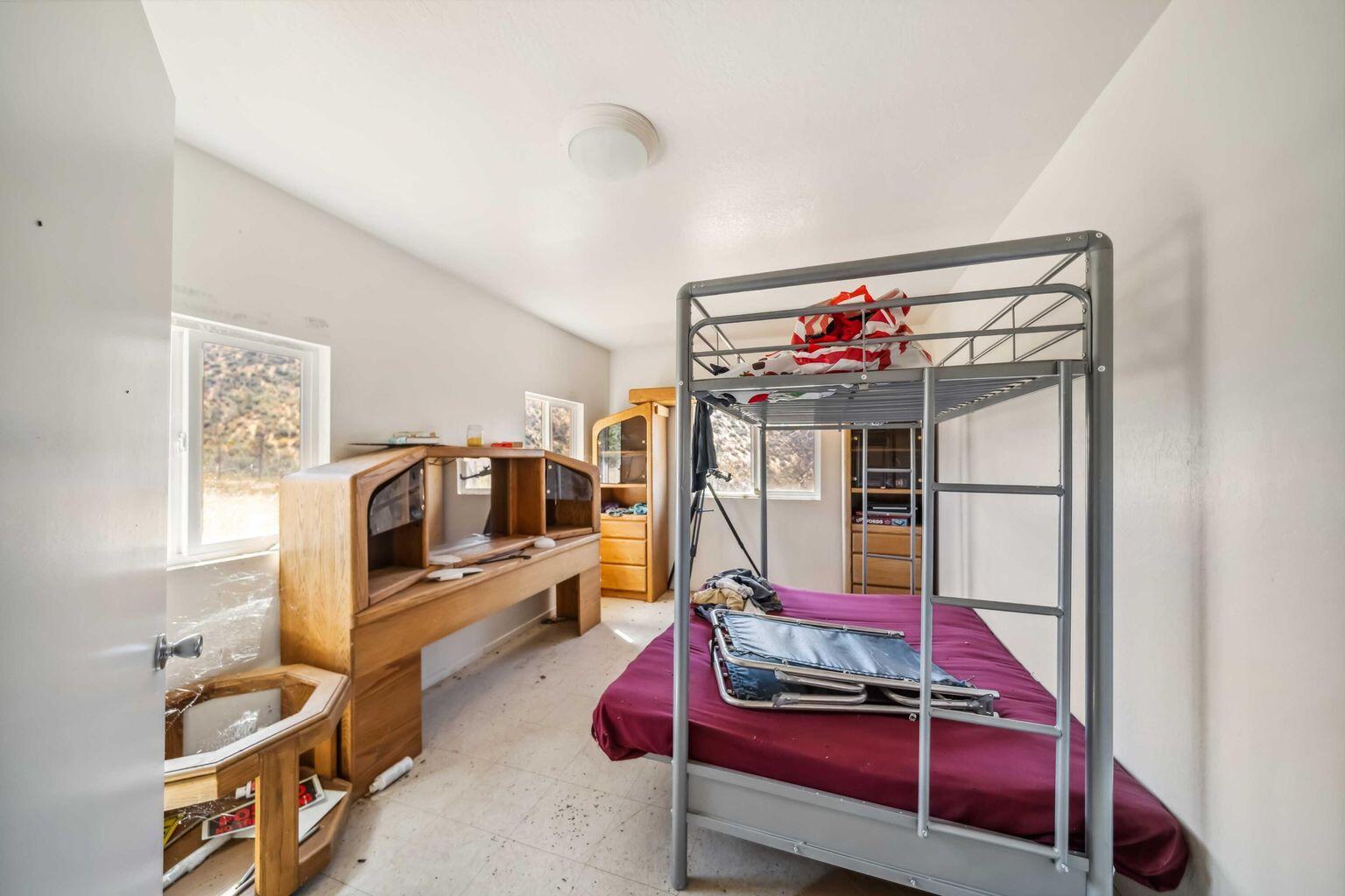 0 Vestal Road Platina, CA 96076 - Photo 16 of 34 a bedroom with furniture and a flat screen tv