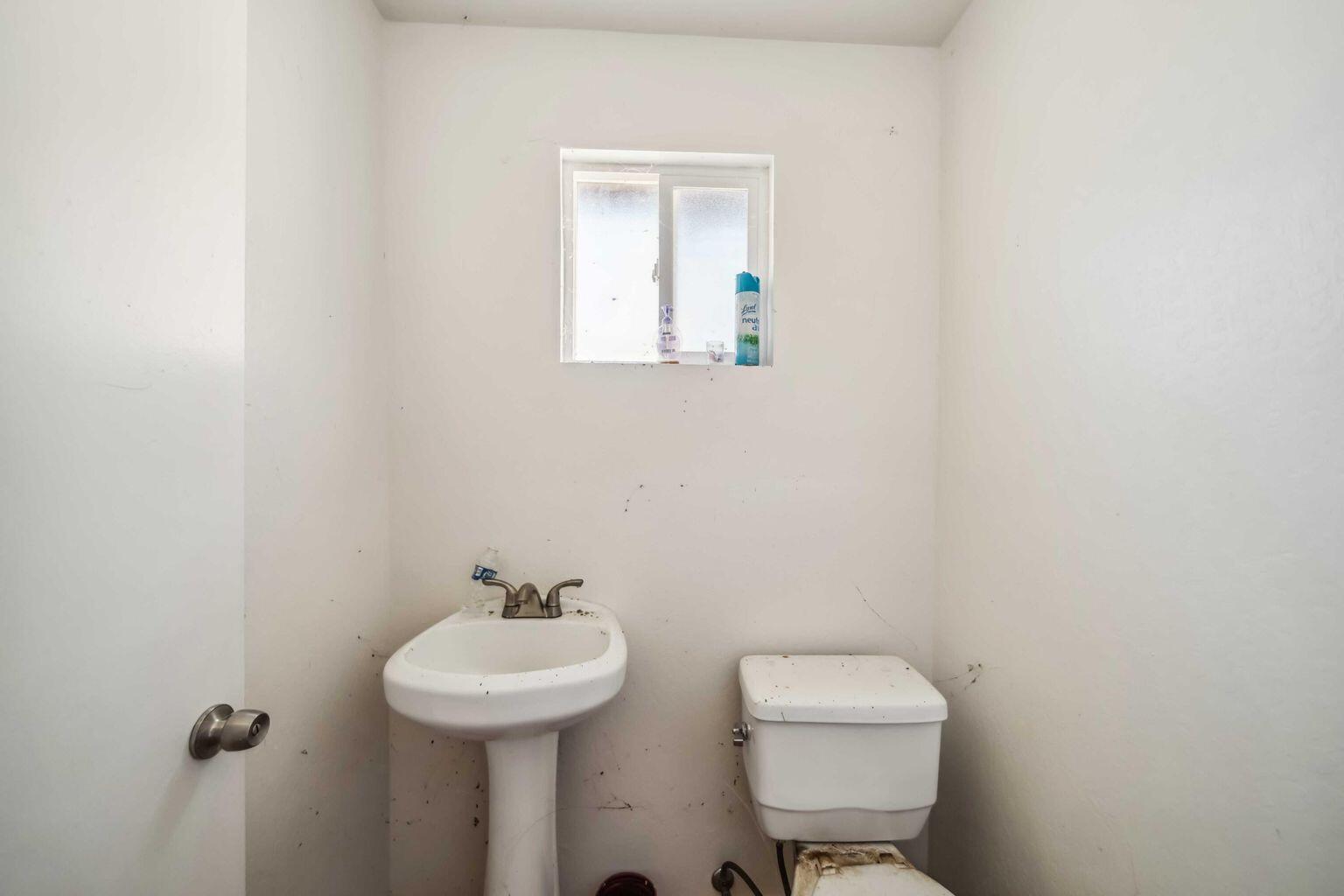 0 Vestal Road Platina, CA 96076 - Photo 18 of 34 a bathroom with a toilet sink and mirror