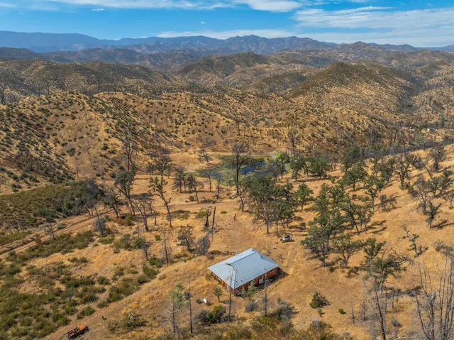an aerial view of residential house with parking space