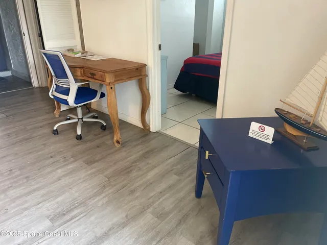 a workspace with furniture and wooden floor