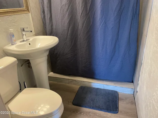 a bathroom with a sink and toilet