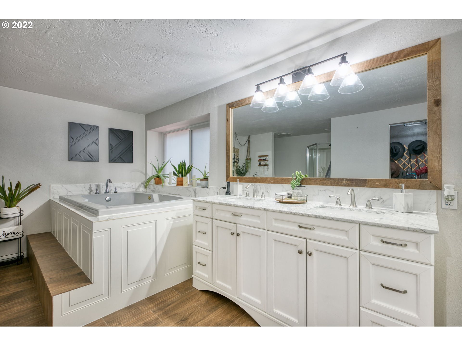 85903 Bailey Hill Road Eugene, OR 97405 - Photo 16 of 27 a spacious bathroom with a double vanity sink and a mirror