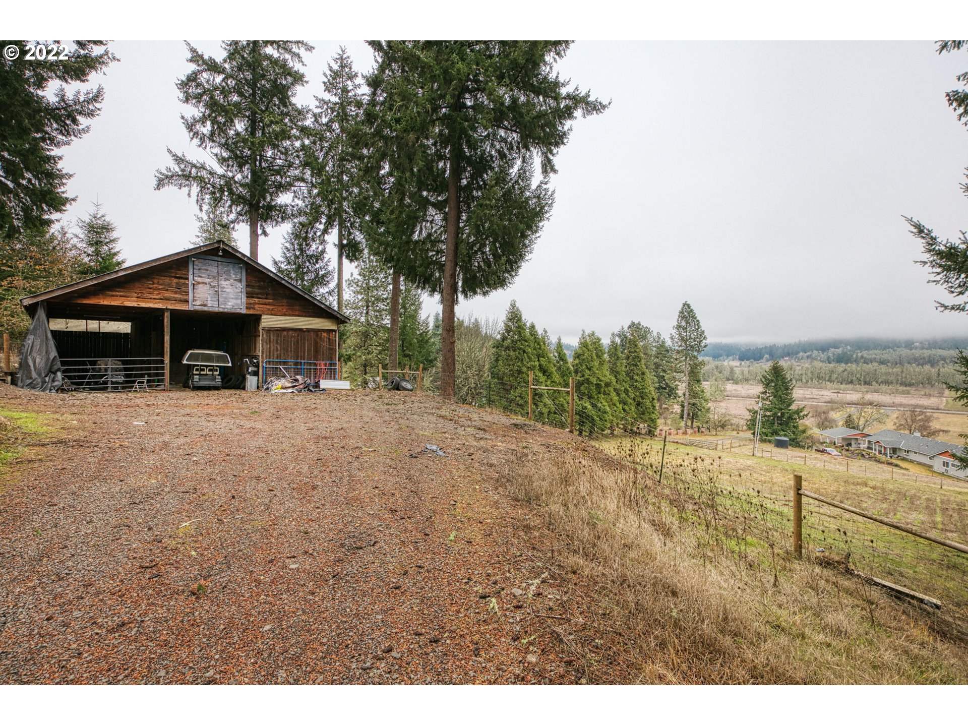 85903 Bailey Hill Road Eugene, OR 97405 - Photo 22 of 27 a front view of a house with a garden and yard
