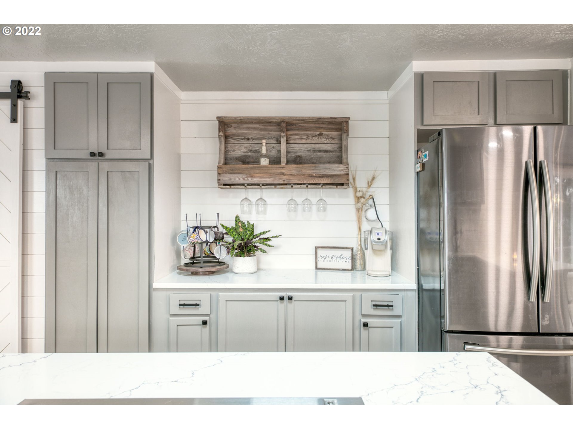 85903 Bailey Hill Road Eugene, OR 97405 - Photo 7 of 27 a kitchen with stainless steel appliances kitchen island a refrigerator sink and cabinets