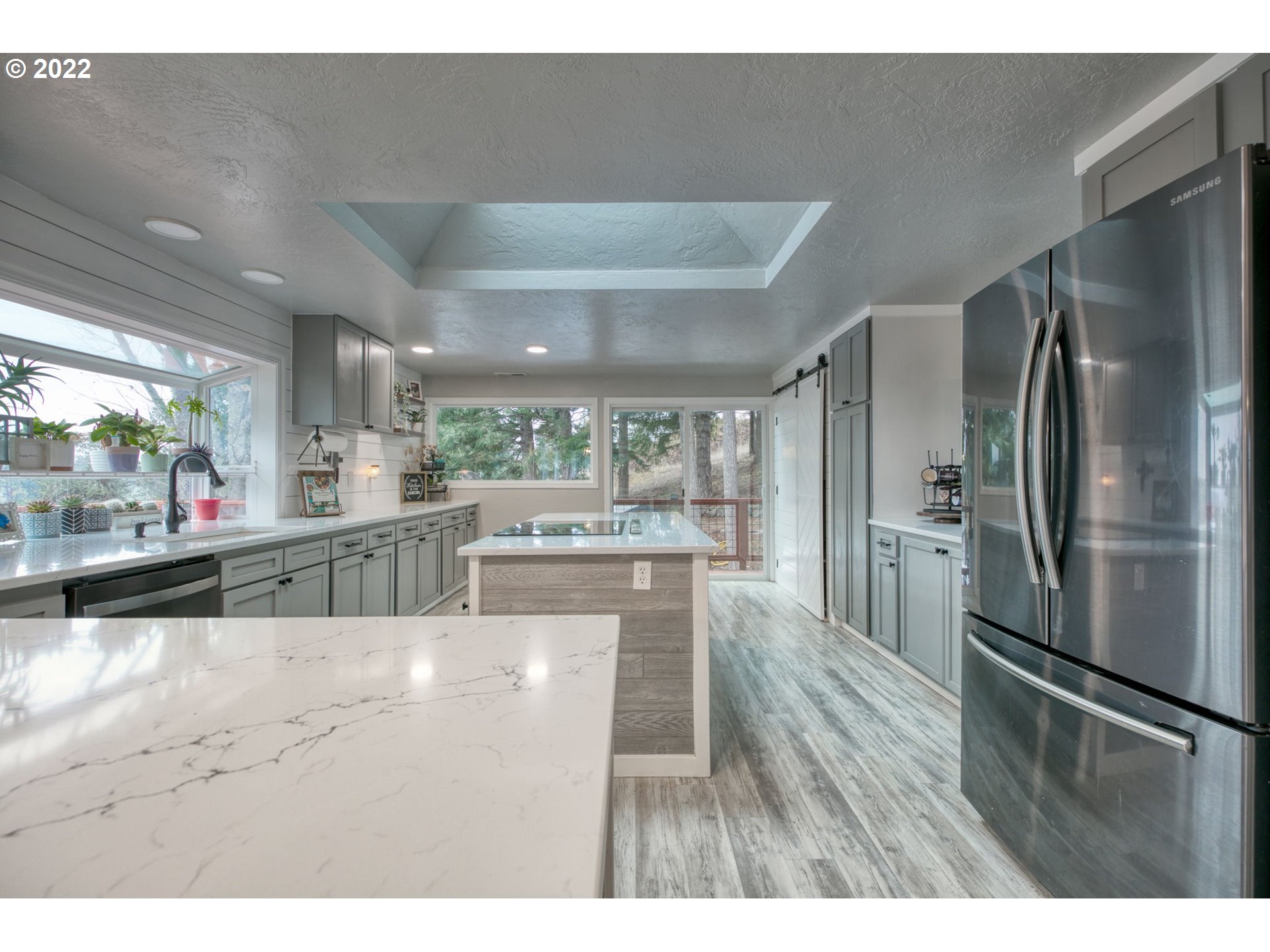 85903 Bailey Hill Road Eugene, OR 97405 - Photo 8 of 27 a kitchen with stainless steel appliances granite countertop a refrigerator a sink and a stove