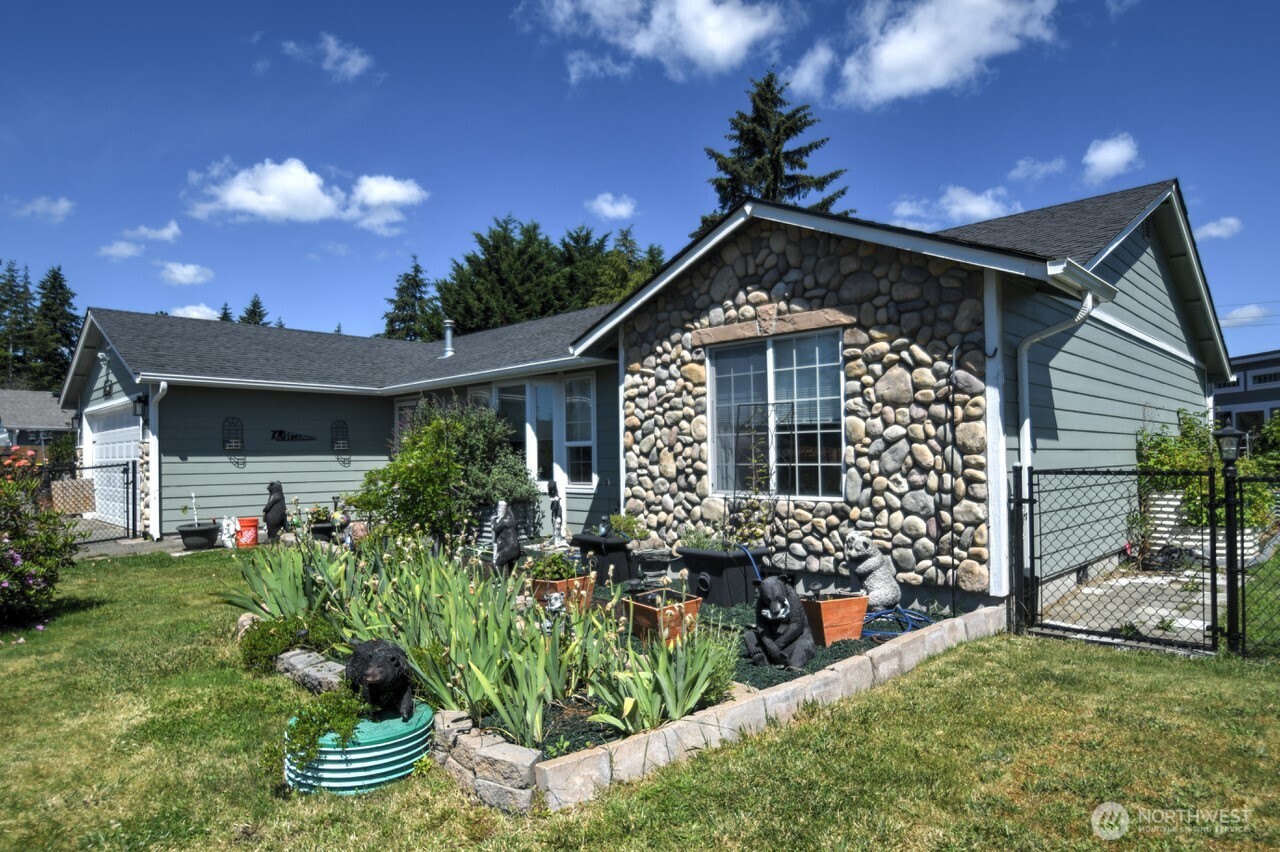 5922 184th Lane Southwest Rochester, WA 98579 - Photo 34 of 34 a front view of a house with a yard