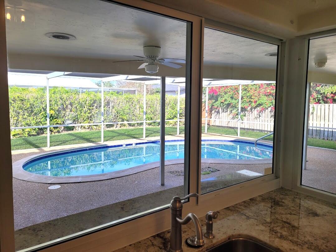 1927 Sharon Street Boca Raton, FL 33486 - Photo 12 of 23 20250128_153246 Kitchen Passthru windows