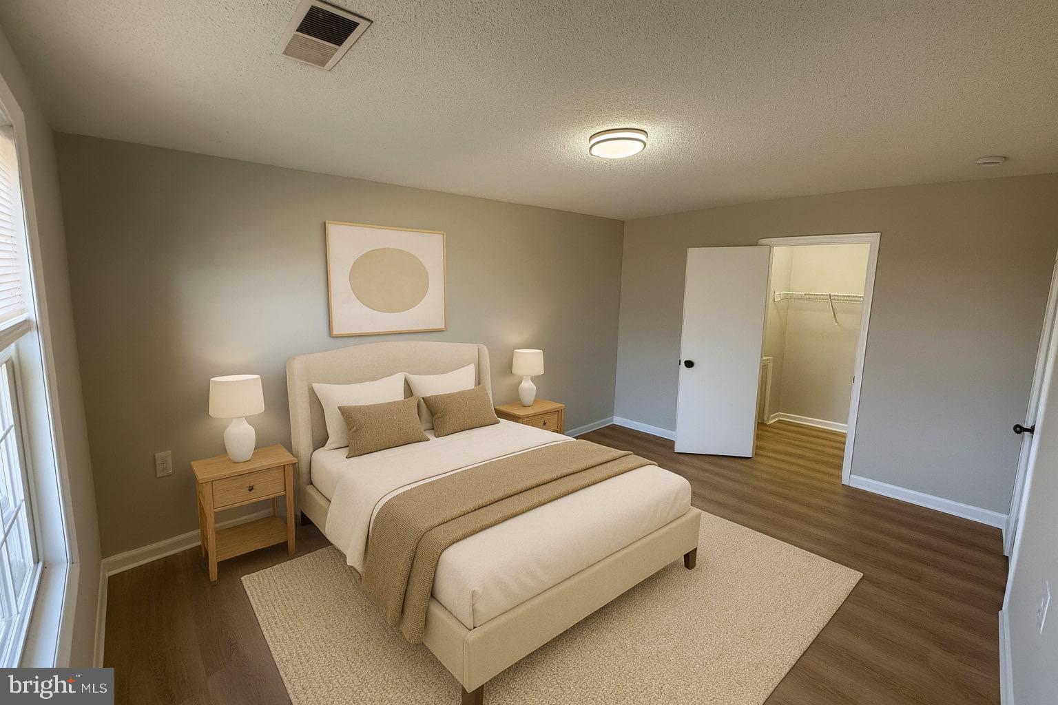 3801 Swann Road, Unit 303 Suitland, MD 20746 - Photo 10 of 19 Master bedroom with walk-in closet. AI staged.