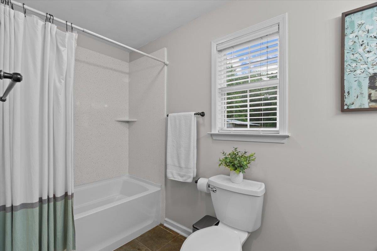 150 Liberty Road Moscow, TN 38057 - Photo 12 of 36 Bathroom featuring a white tub and shower combination with a textured surround
