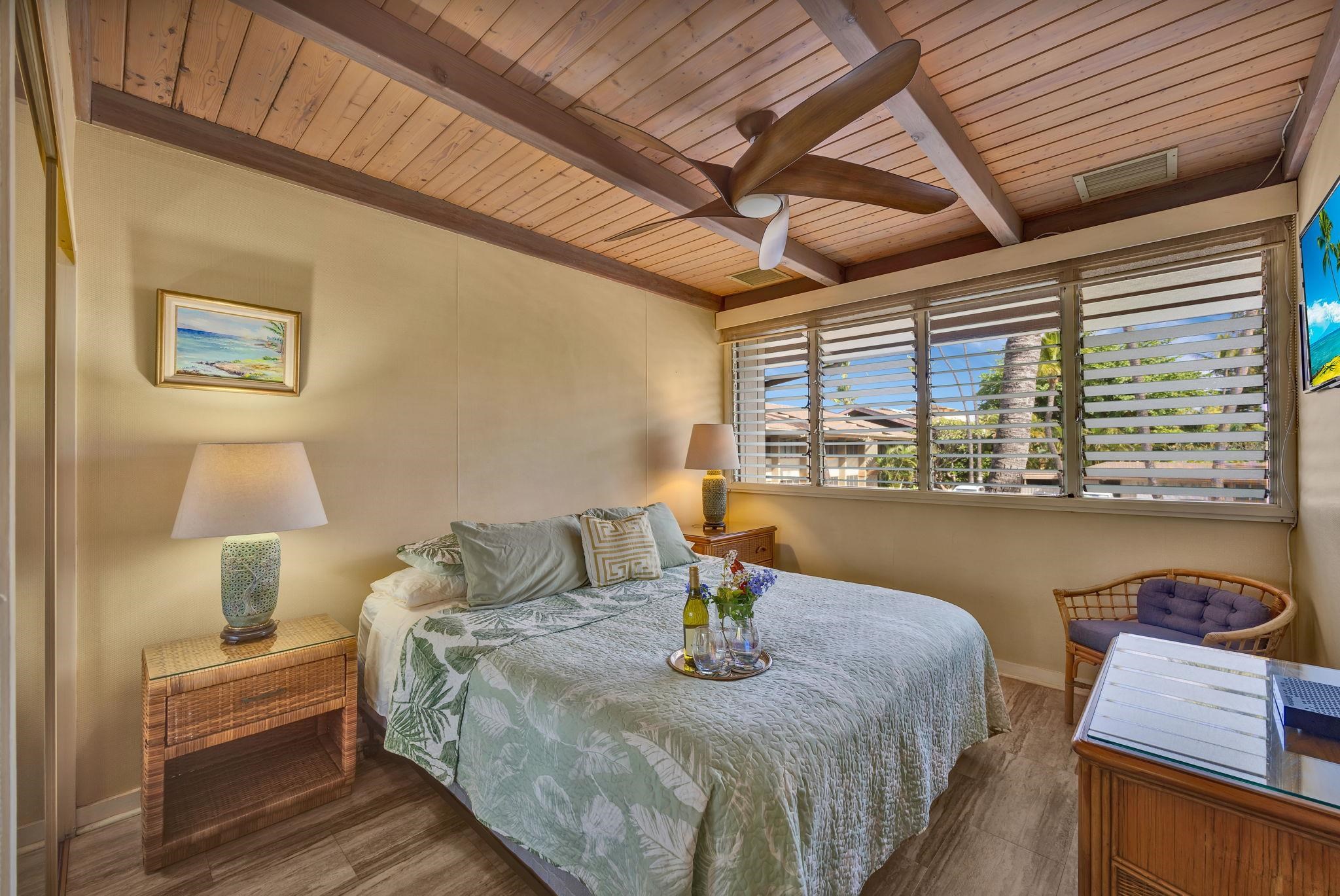3691 Lower Honoapiilani Road, Unit 211 Lahaina, HI 96761 - Photo 14 of 47 a living room with furniture and a large window