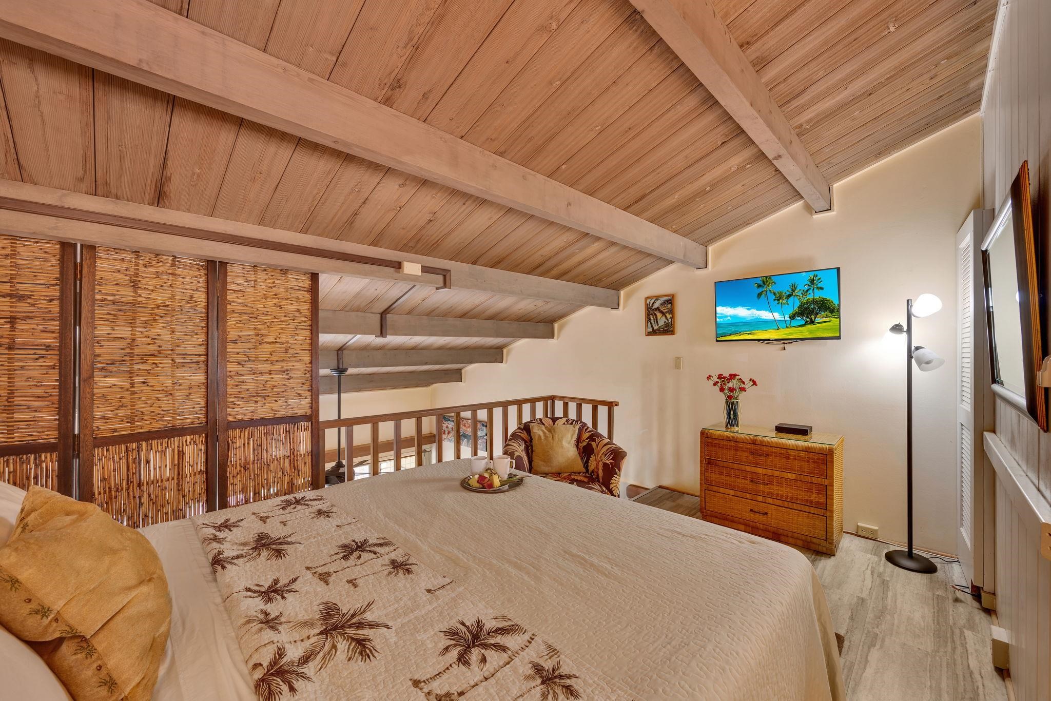 3691 Lower Honoapiilani Road, Unit 211 Lahaina, HI 96761 - Photo 23 of 47 a bedroom with a bed and a window