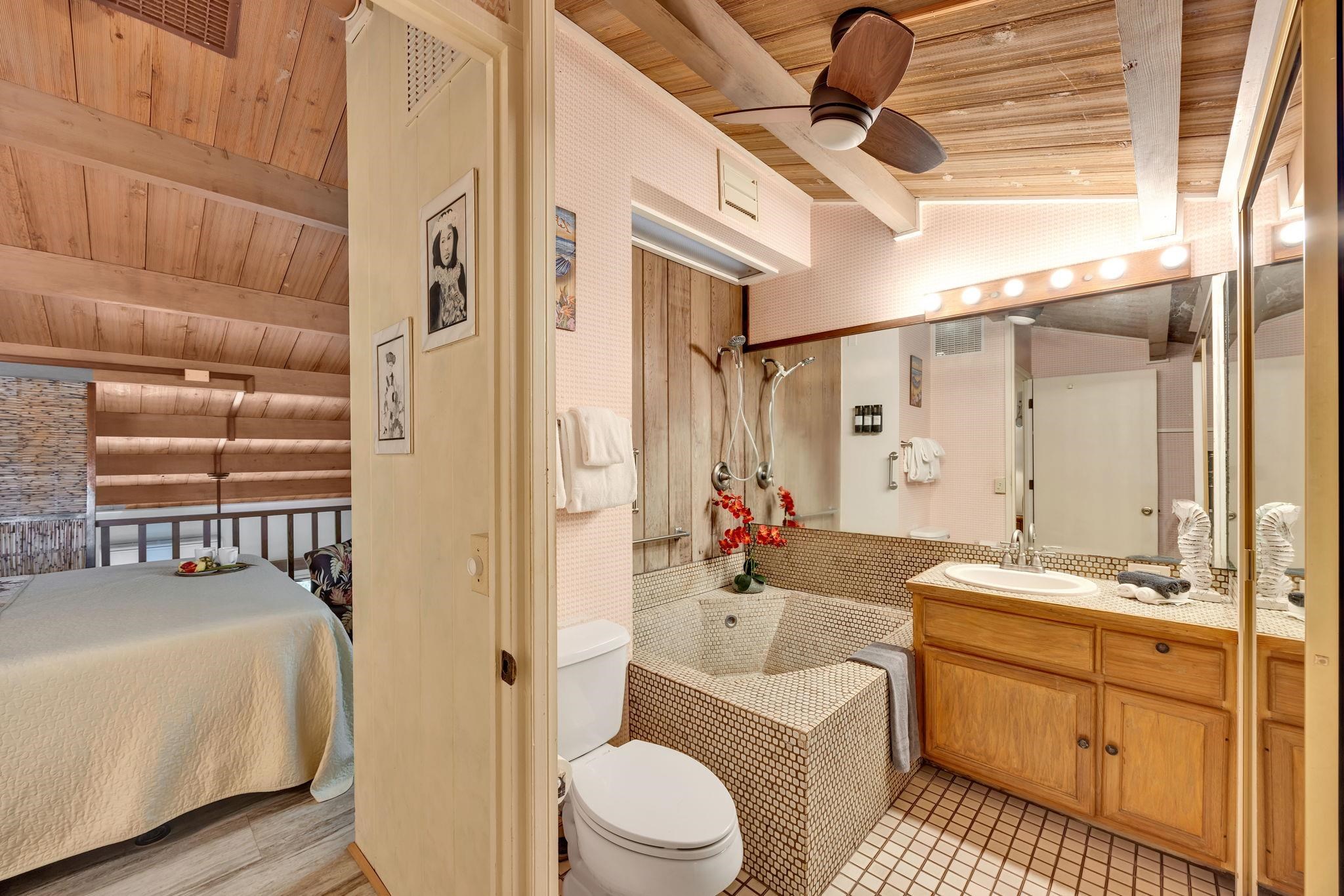 3691 Lower Honoapiilani Road, Unit 211 Lahaina, HI 96761 - Photo 25 of 47 a bathroom with a sink a toilet a mirror and shower