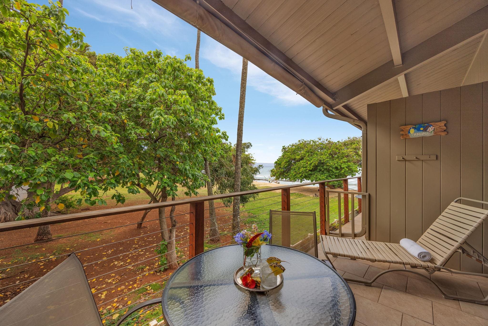 3691 Lower Honoapiilani Road, Unit 211 Lahaina, HI 96761 - Photo 29 of 47 a view of a balcony with chair and wooden floor