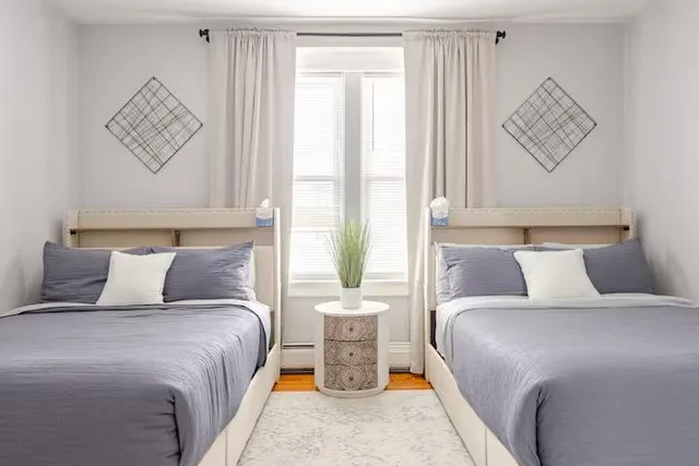 a bedroom with a bed and window