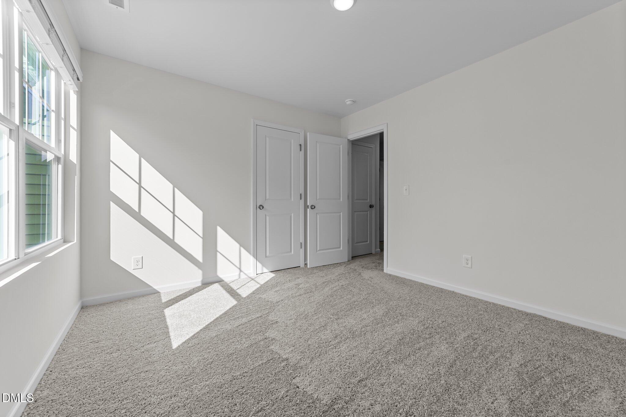 326 Shiloh Way Mebane, NC 27302 - Photo 27 of 34 a view of an empty room with a window