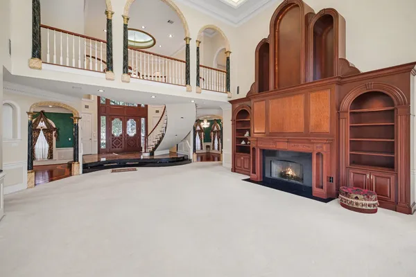 a view of hall way with furniture