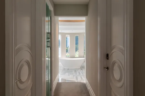 a bathroom with a glass shower door