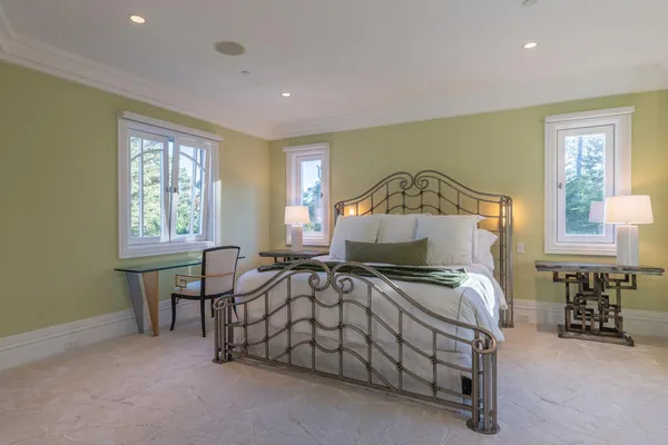 a bedroom with a bed and a table in it