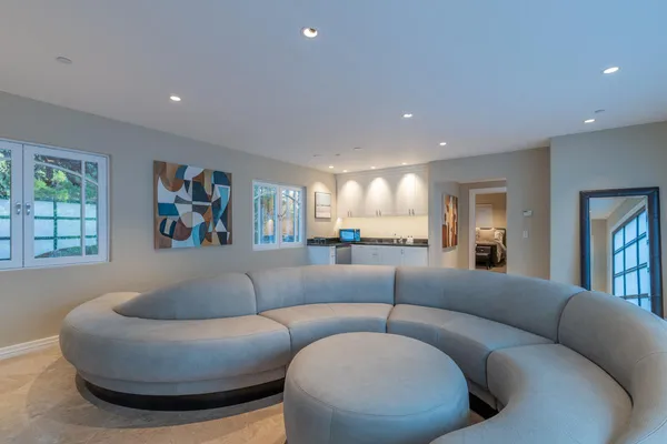 a living room with furniture and a large window
