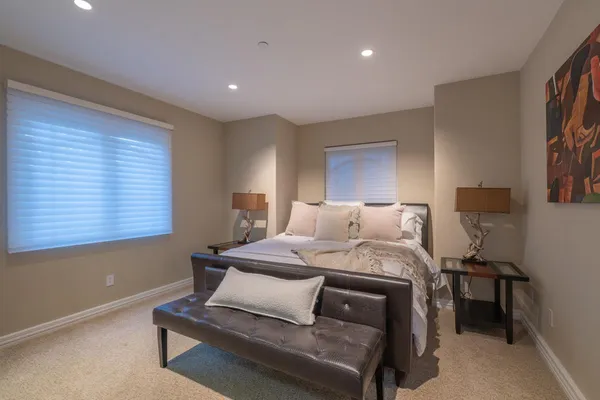 a bedroom with a bed and window