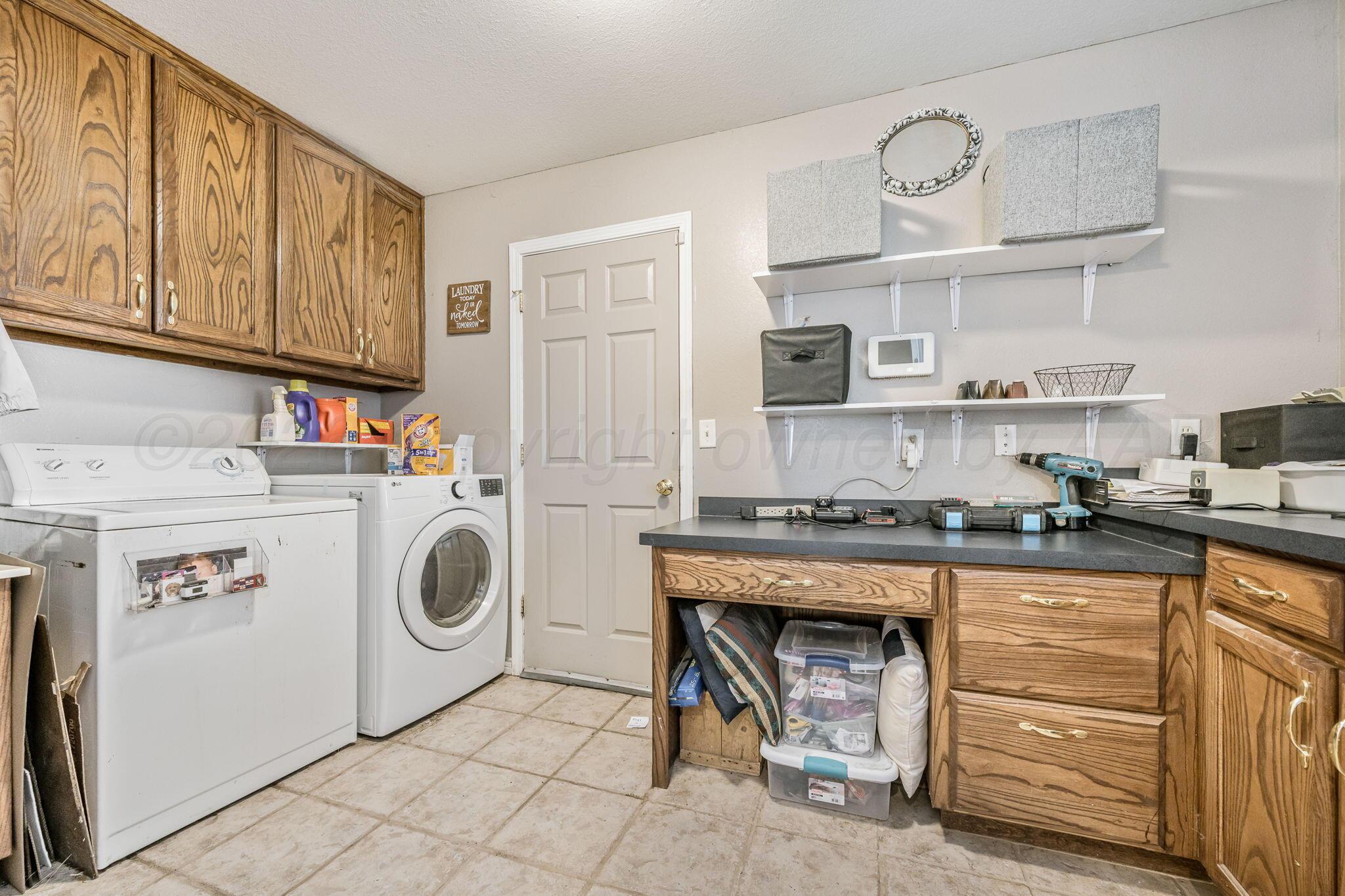 200 Hunters Trail Bushland, TX 79124 - Photo 10 of 23 a kitchen with cabinets a stove and a refrigerator