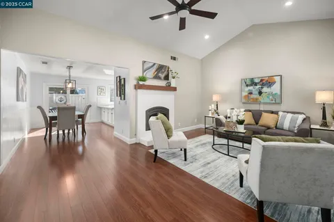 a living room with furniture and fireplace