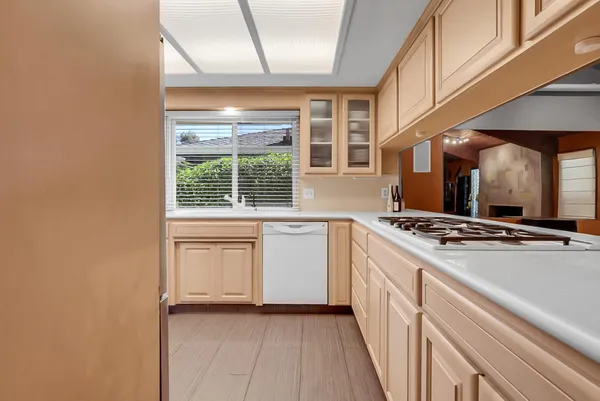 a kitchen with stainless steel appliances a stove and a refrigerator