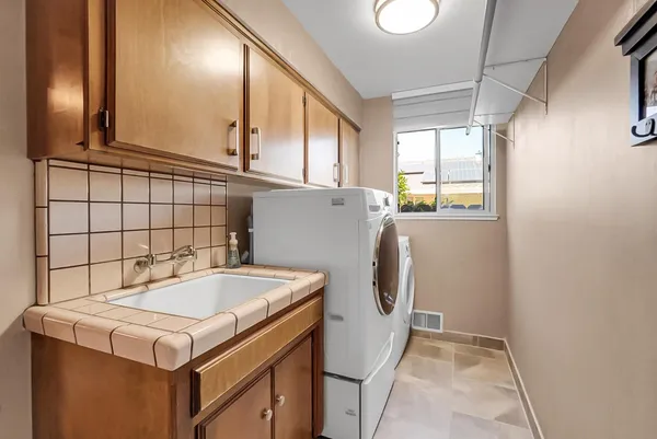 a utility room with dryer and washer