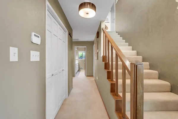 a view of a hallway with windows