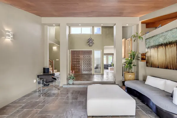 a living room with furniture and a large window
