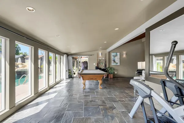 a lobby with furniture and floor to ceiling window