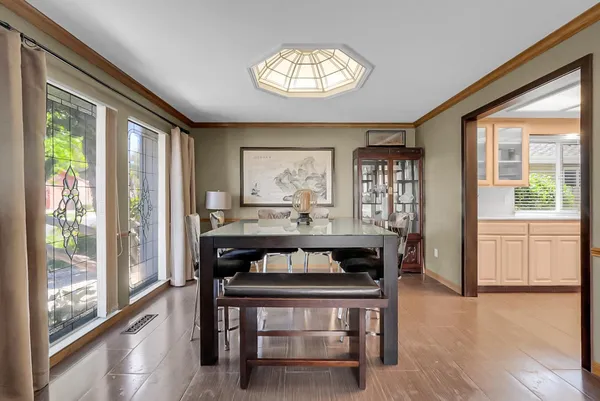 a view of a dining room with furniture window and outside view