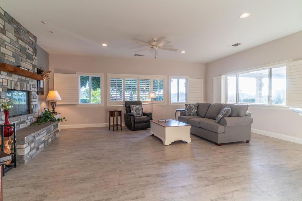 30646 Red Hawk Road Valley Center, CA 92082 - Photo 26 of 69 a living room with furniture and a flat screen tv