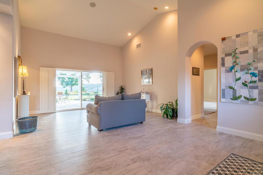 30646 Red Hawk Road Valley Center, CA 92082 - Photo 28 of 69 a living room with furniture and a large window