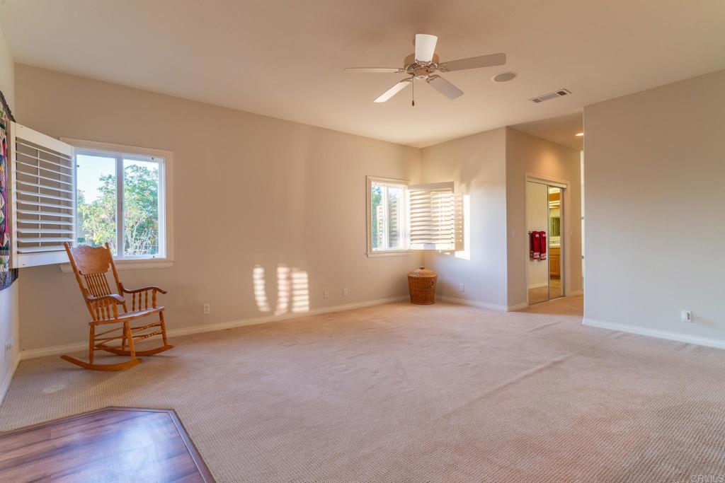 30646 Red Hawk Road Valley Center, CA 92082 - Photo 34 of 69 a view of an empty room with a window and chair