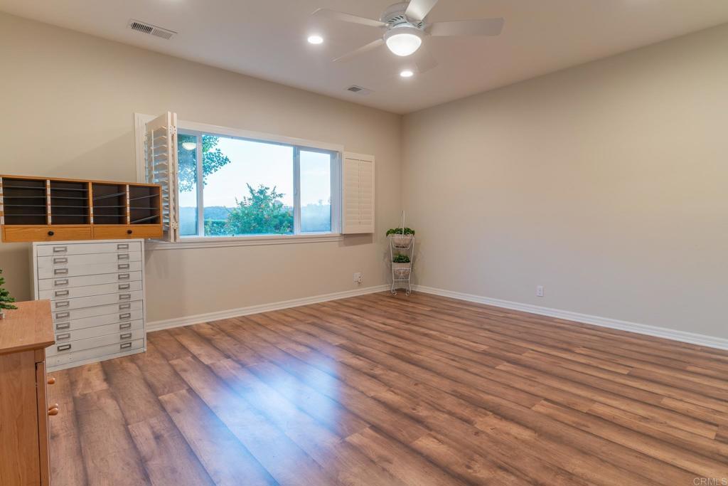 30646 Red Hawk Road Valley Center, CA 92082 - Photo 37 of 69 wooden floor in an empty room with a window