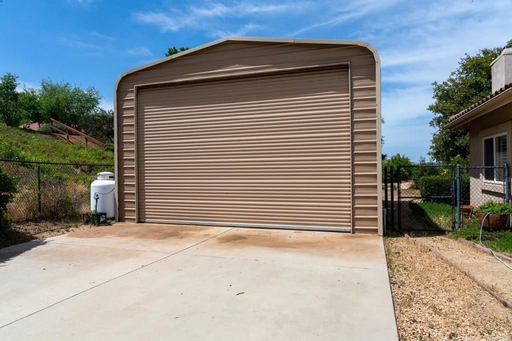 30646 Red Hawk Road Valley Center, CA 92082 - Photo 7 of 69 a view of backyard with barbeque grill and plants