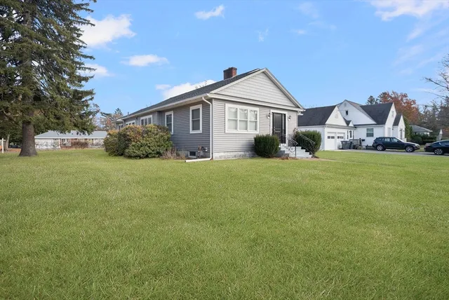 a front view of a house with a yard