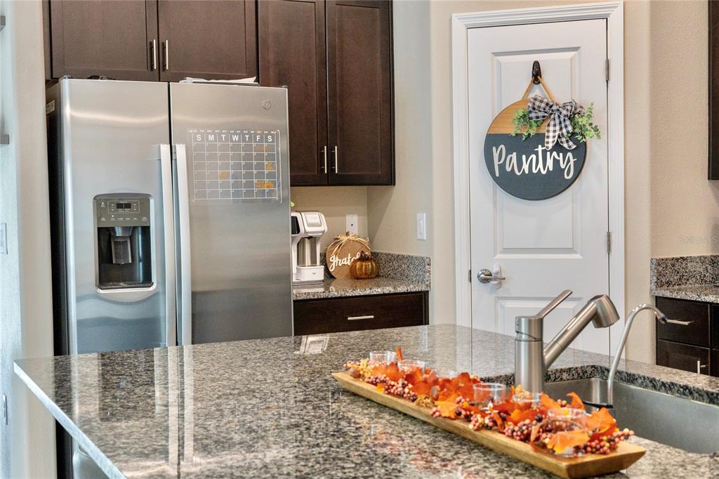 1628 Red Loop Lakeland, FL 33801 - Photo 12 of 37 a kitchen with stainless steel appliances kitchen island granite countertop a refrigerator and stove
