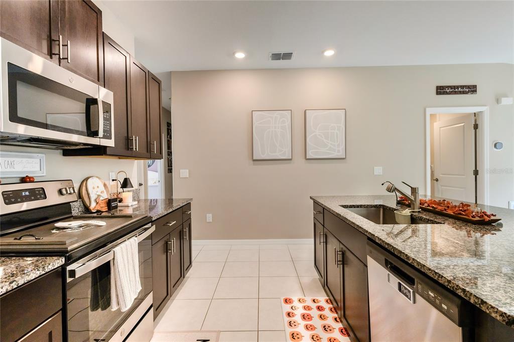 1628 Red Loop Lakeland, FL 33801 - Photo 13 of 37 a kitchen that has a sink and a stove