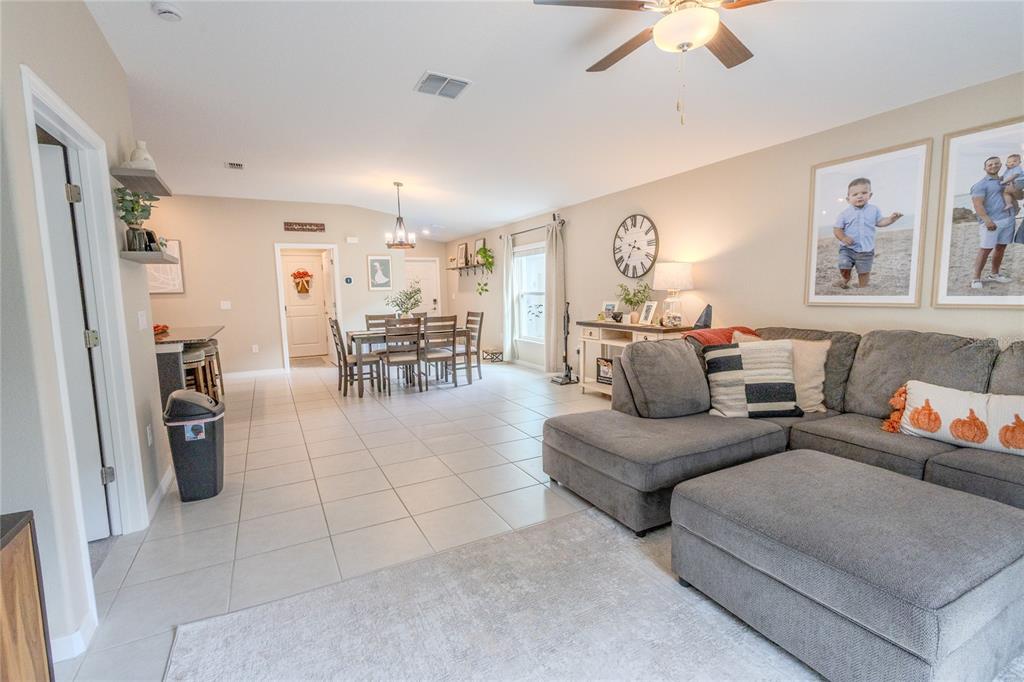 1628 Red Loop Lakeland, FL 33801 - Photo 17 of 37 a living room with furniture and a dining table
