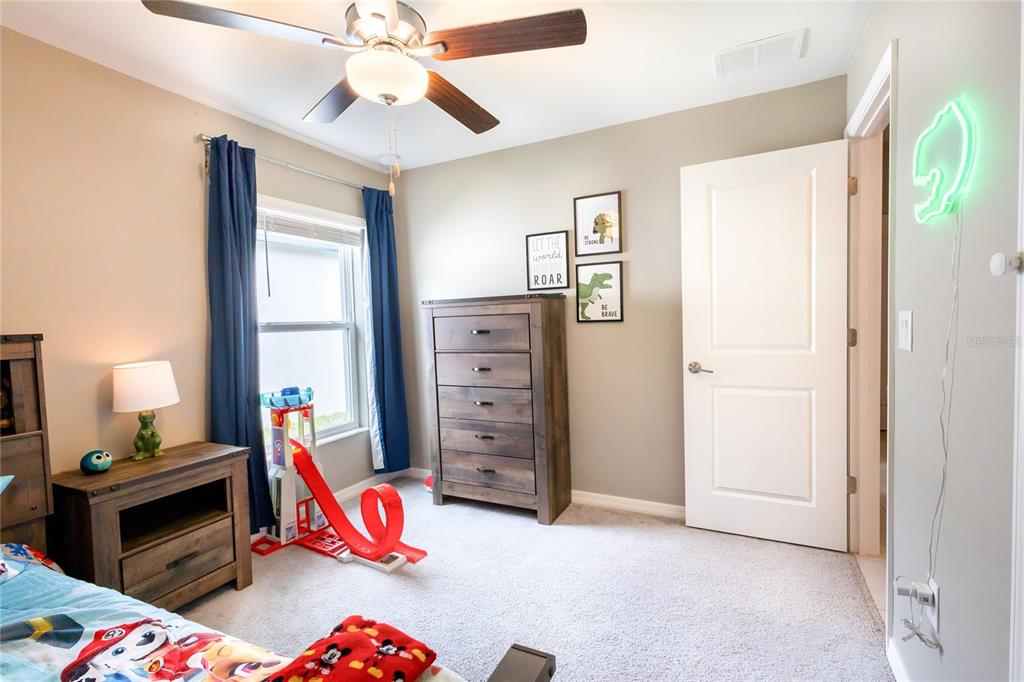 1628 Red Loop Lakeland, FL 33801 - Photo 23 of 37 a bedroom with furniture and a window