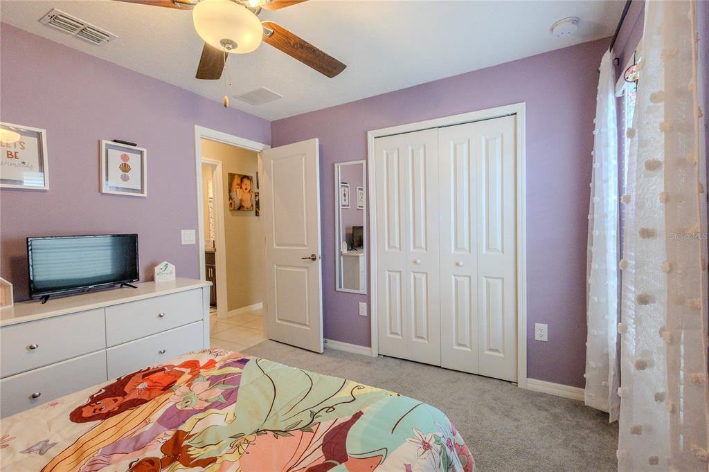 1628 Red Loop Lakeland, FL 33801 - Photo 27 of 37 a bedroom with a bed and a flat screen tv