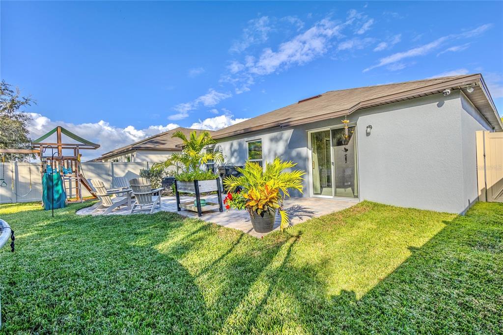 1628 Red Loop Lakeland, FL 33801 - Photo 30 of 37 a view of a house with a porch and a yard