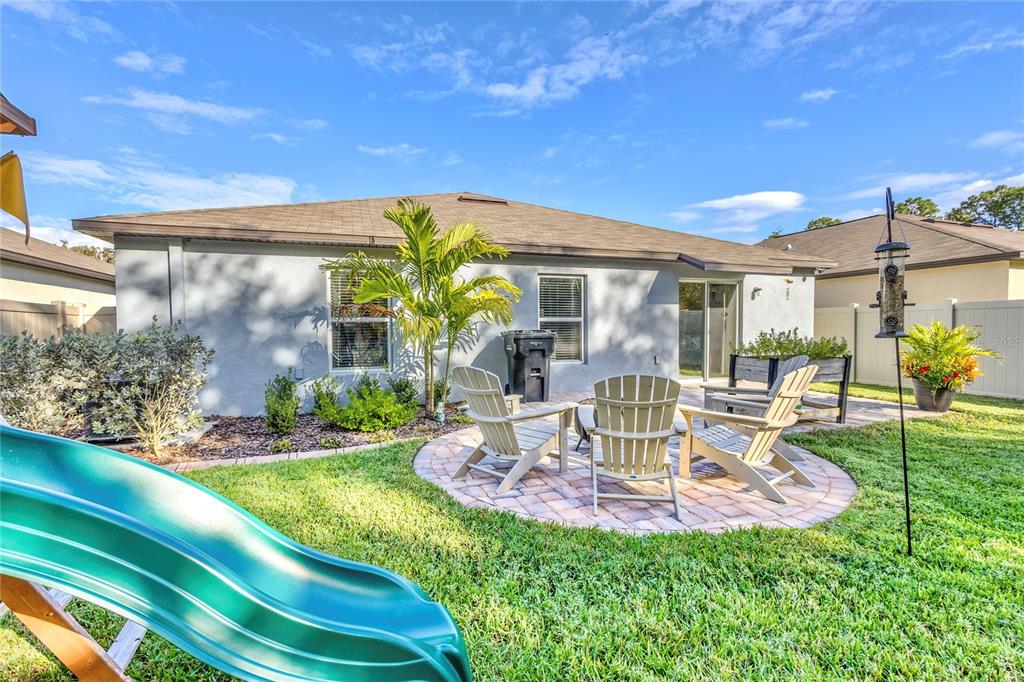 1628 Red Loop Lakeland, FL 33801 - Photo 5 of 37 a view of a house with a backyard porch and sitting area