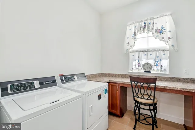 a bedroom with bed and wooden floor